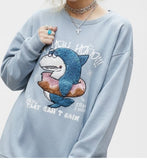 shark boa and a loose, loose-fitting sweatshirt